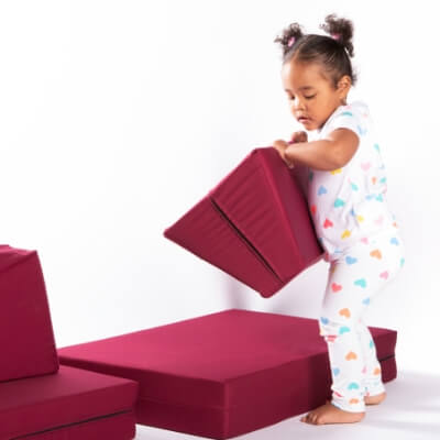 A little girl playing with the Blocks