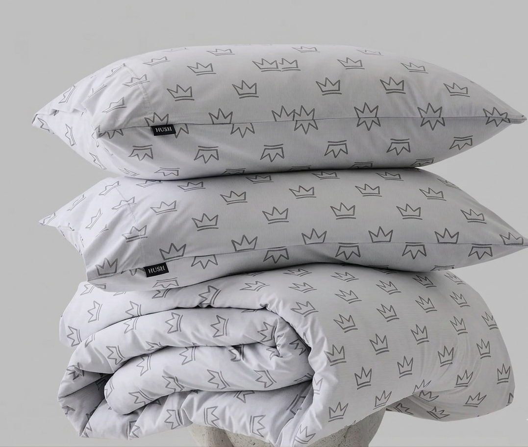 Foam King Crown Duvet Cover Set on a queen bed